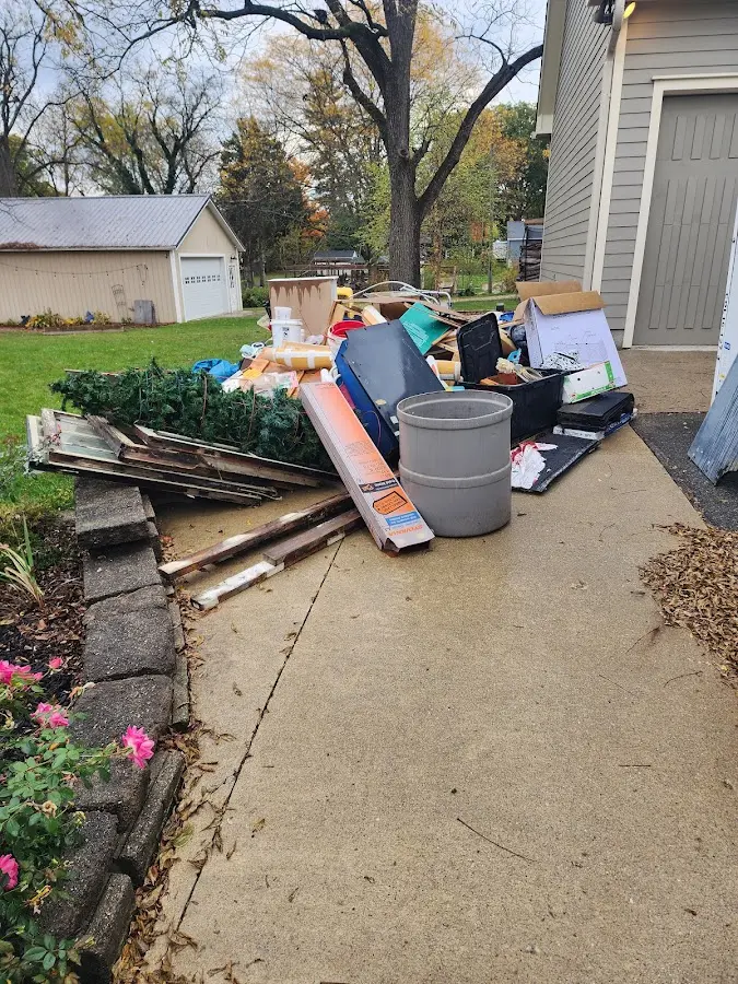 Dumpster being loaded with debris for 30 Yard Dumpster Rental in San Joaquin